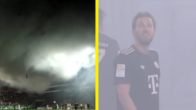 Flares lit by fans filled the stadium with smoke, forcing a nine-minute stoppage